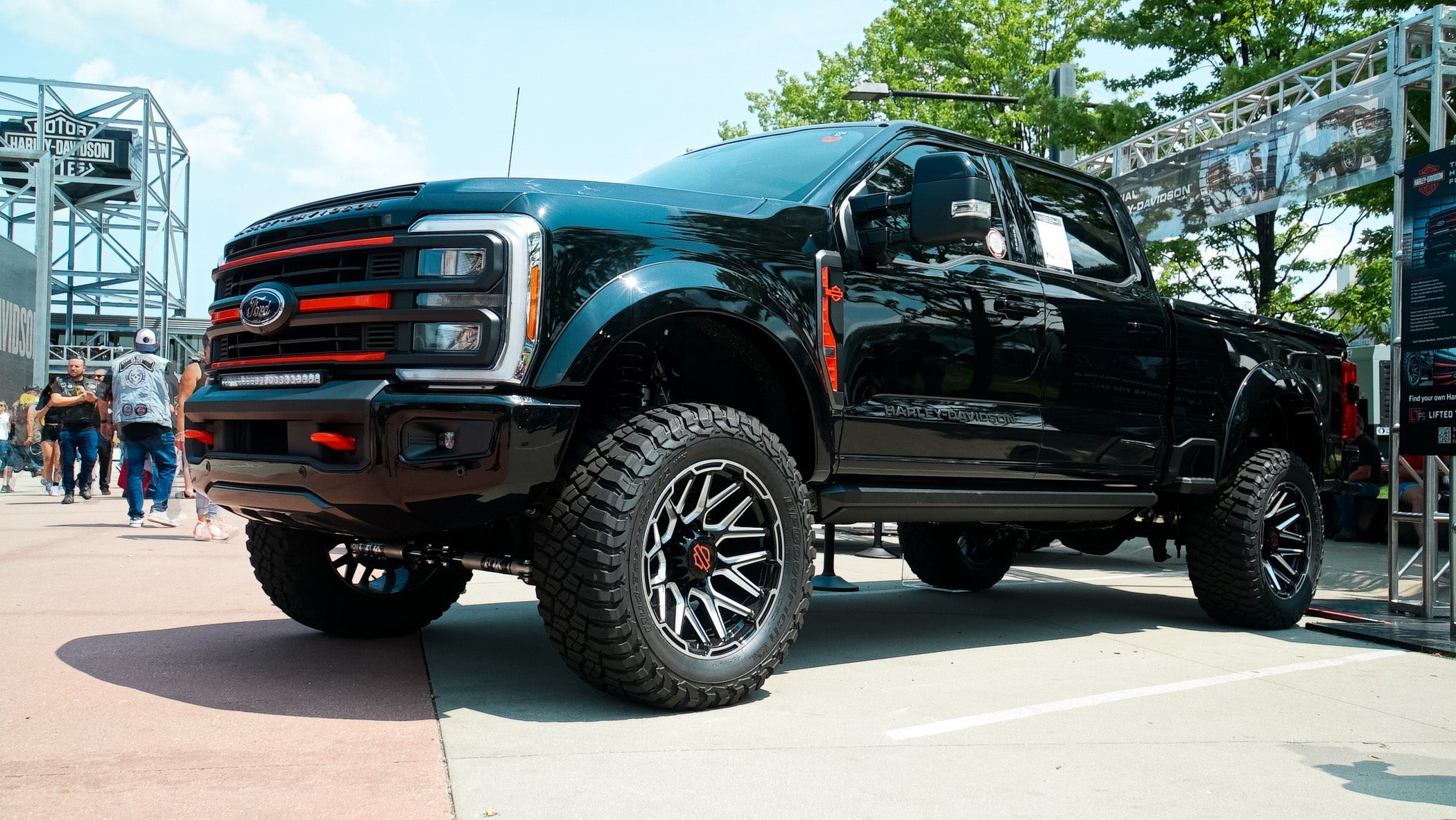Harley-Davidson F-250 quarter view image, with truck parked at a truck show.
