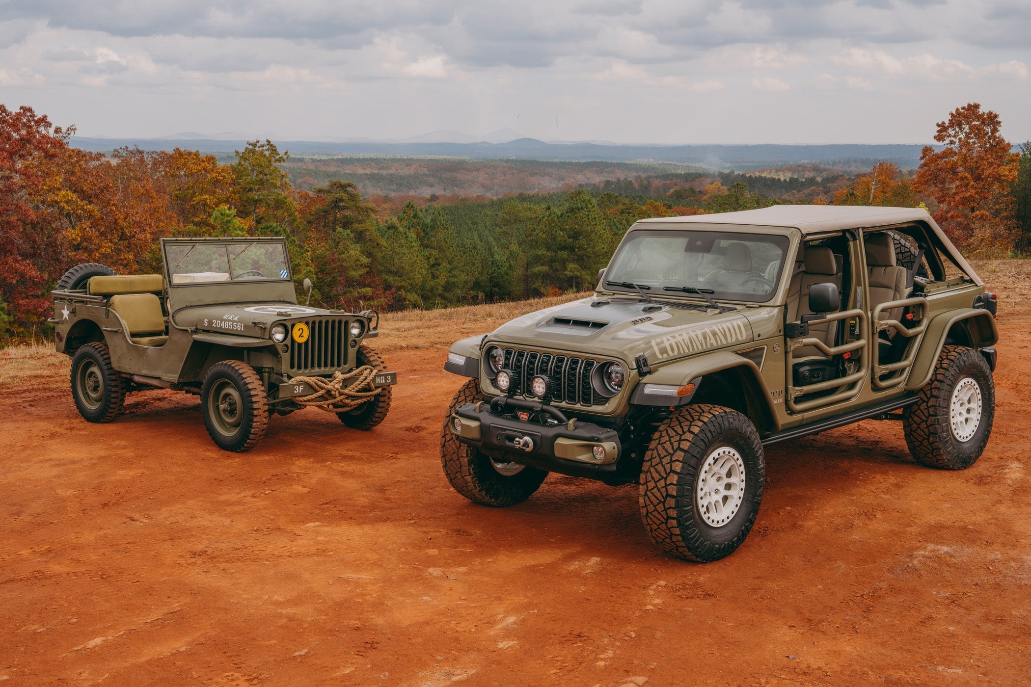 Modern Jeep Commando with vintage Jeepster Commando from the 1960s era parked in an off-road scene.